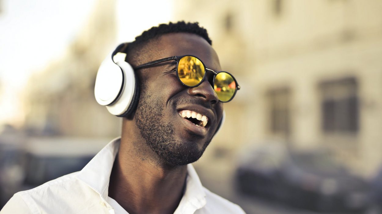 photo of man using headphones